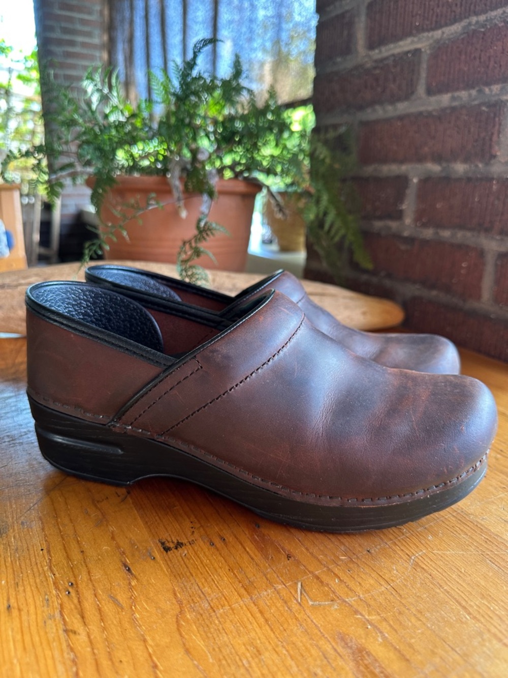Dansko Professional clog in antique oiled brown leather. Size US 9/Euro 39